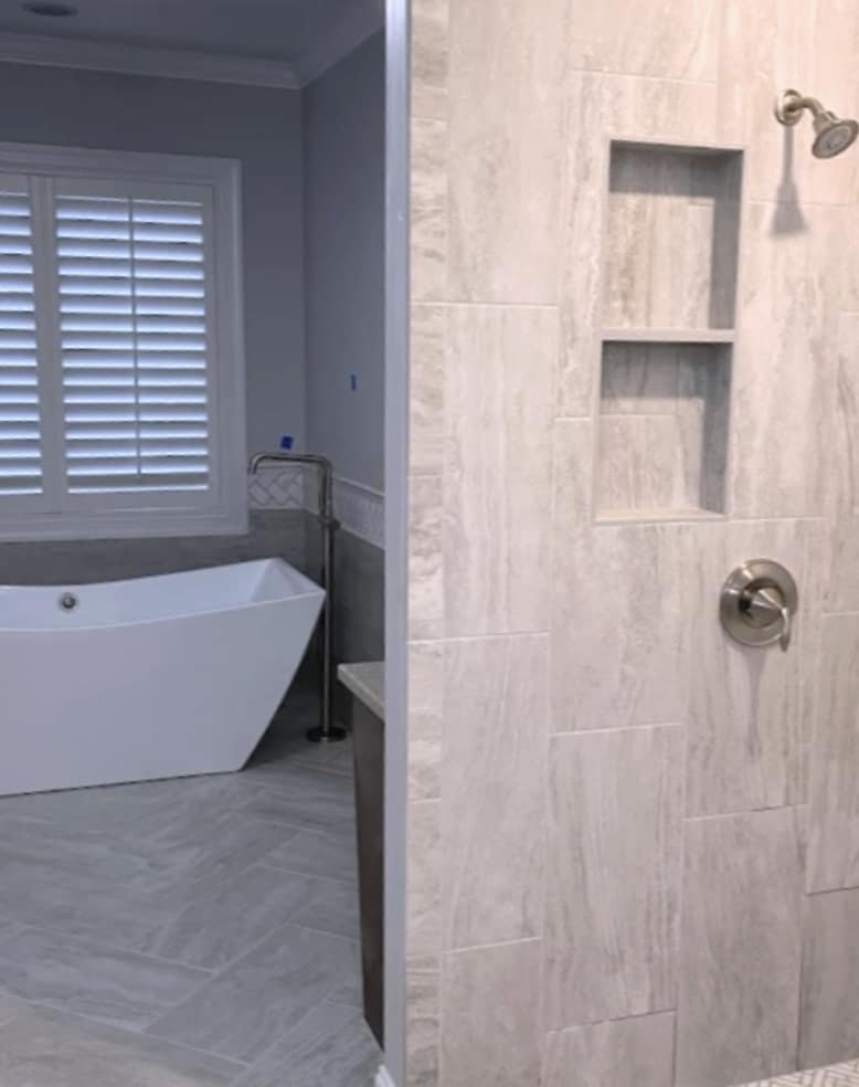 Bathroom with a freestanding tub and a tiled walk-in shower